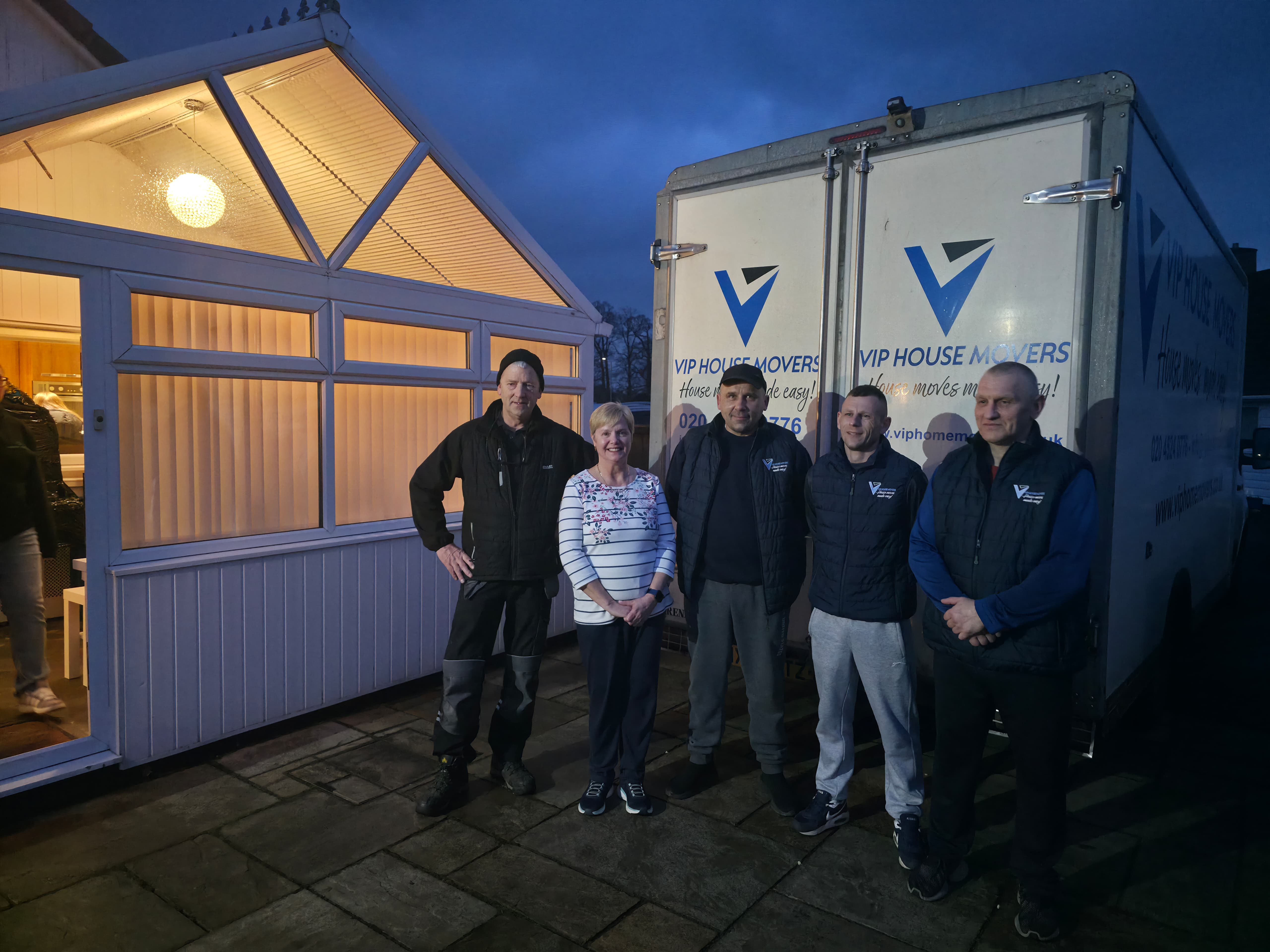 VIP House Movers professional team with satisfied customer after a successful move